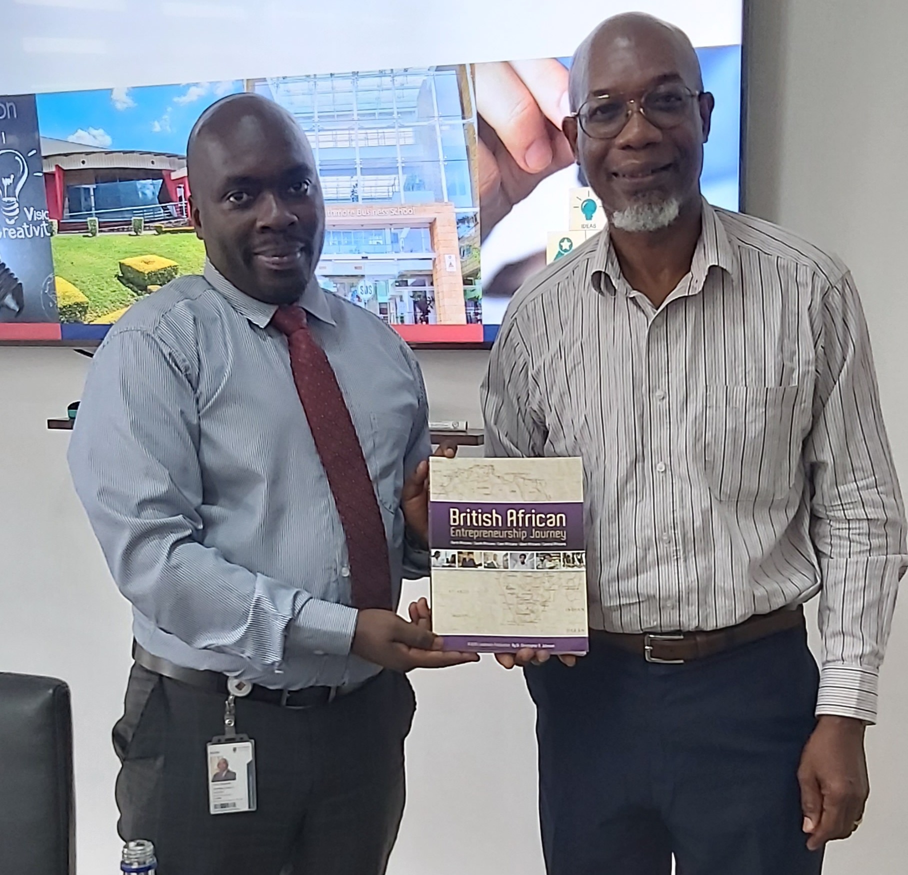 Dr Christopher A. Johnson and Clive Asande in discussion